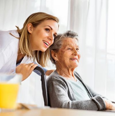 Aspire Home Health Care nurse with elderly lady in wheelchair